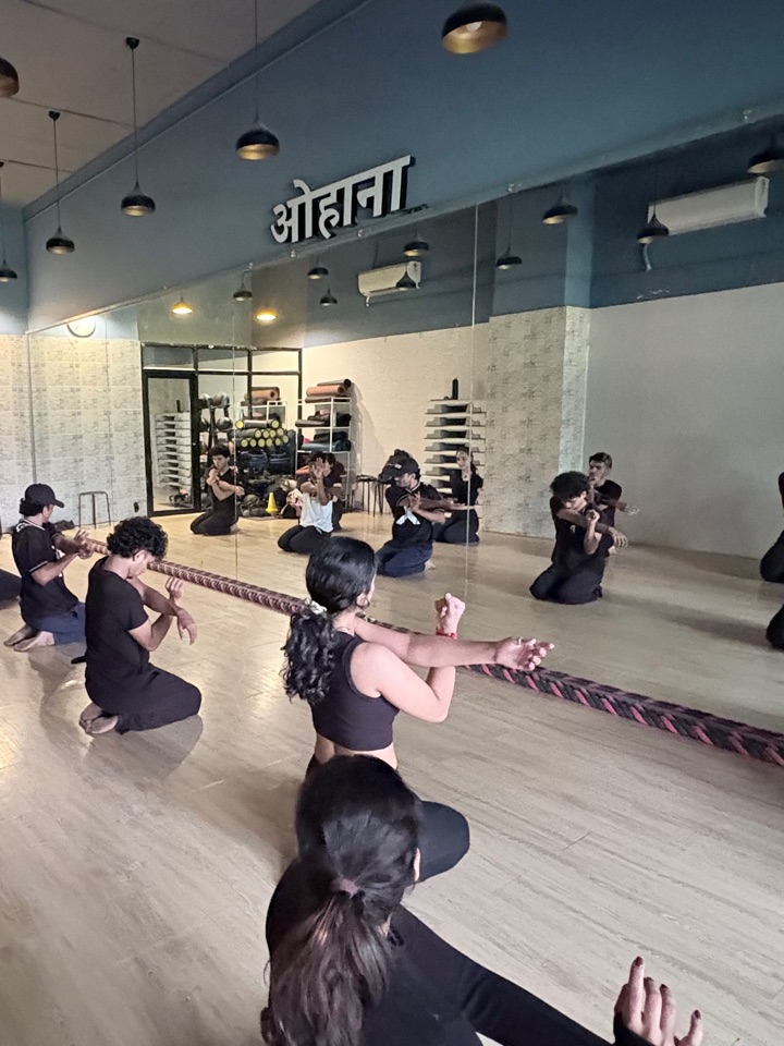 A contemporary class working on the floor